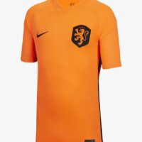 A soccer jersey with an orange background and black trim.