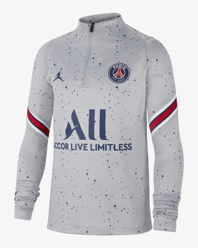 A gray long sleeve shirt with the paris saint germain logo on it.